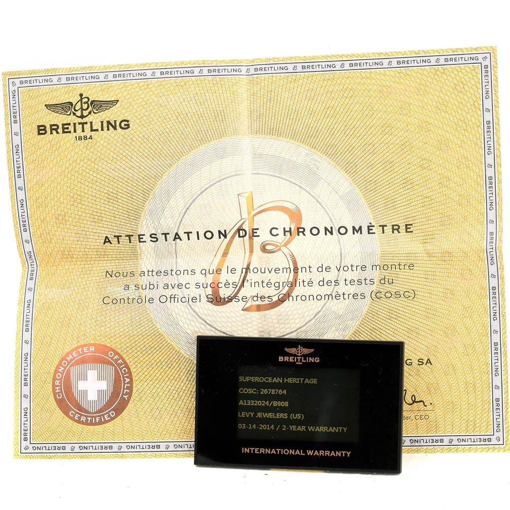 The image shows the Breitling Superocean A13320 Men's Stainless Steel Black Dial A13320 Men's Stainless Steel Black Dial official chronometer certificate and international warranty card.
