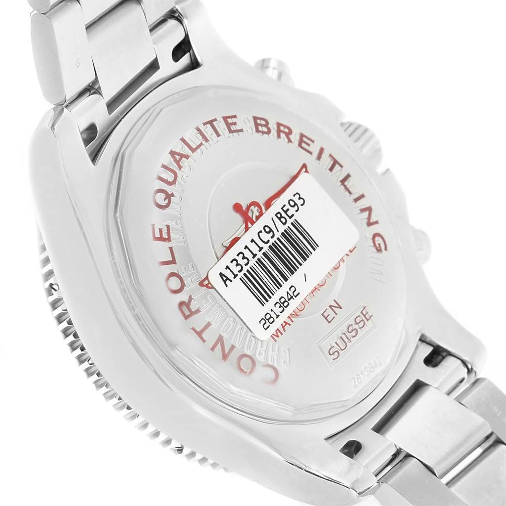 The image shows the case back of a Breitling Superocean A13311C9/BE93-161A Men's Stainless Steel Black Dial A13311C9/BE93-161A Men's Stainless Steel Black Dial watch at an angle, highlighting the engraved details and a barcode sticker.