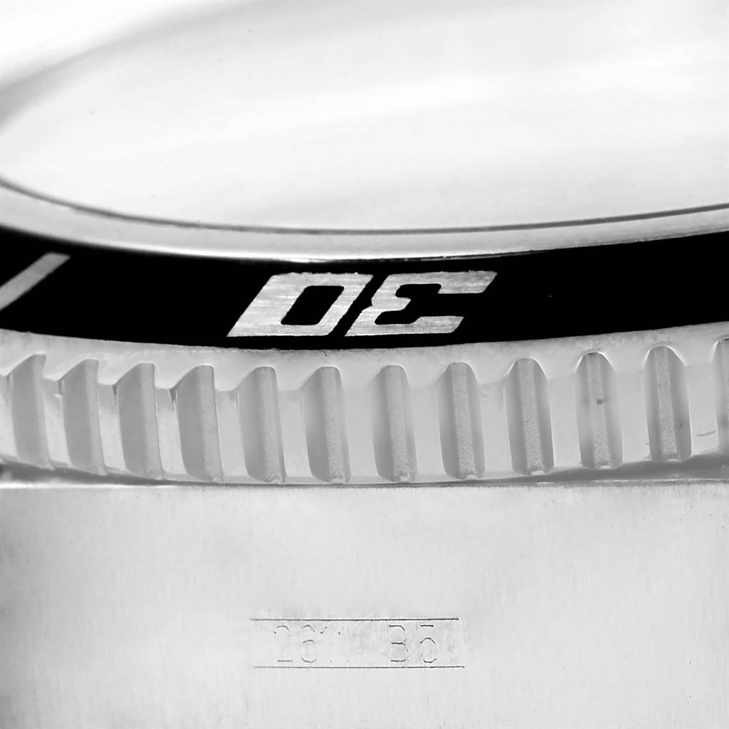 The image shows a close-up of the bezel and part of the case of a Breitling Superocean A17391 Men's Stainless Steel Black Dial A17391 Men's Stainless Steel Black Dial watch.