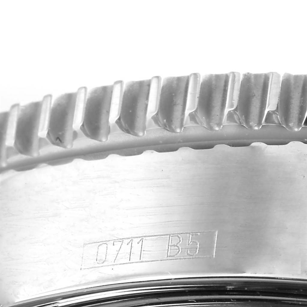 The image shows a close-up of the bezel and part of the case back of a Breitling Superocean A17364 Men's Stainless Steel Black Dial A17364 Men's Stainless Steel Black Dial watch.