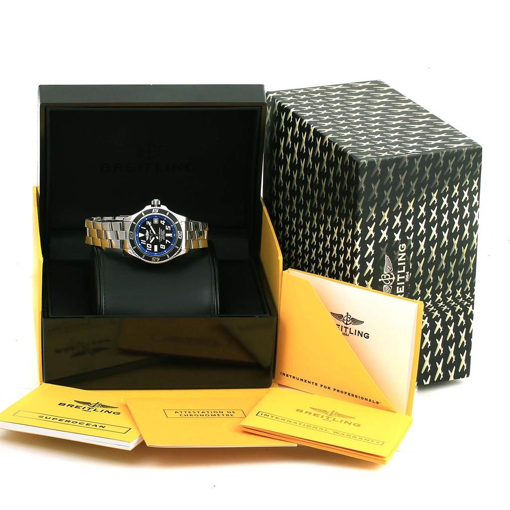 The Breitling Superocean A17364 Men's Stainless Steel Black Dial A17364 Men's Stainless Steel Black Dial watch is displayed front-facing in its box, surrounded by branded documentation and packaging.