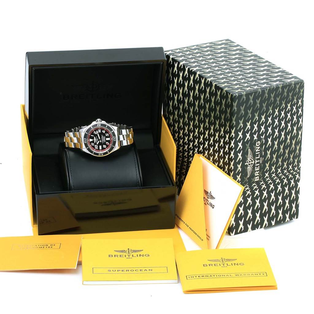 The Breitling Superocean A17364 Men's Stainless Steel Black Dial A17364 Men's Stainless Steel Black Dial watch is shown in an open box, accompanied by its packaging and official documents.