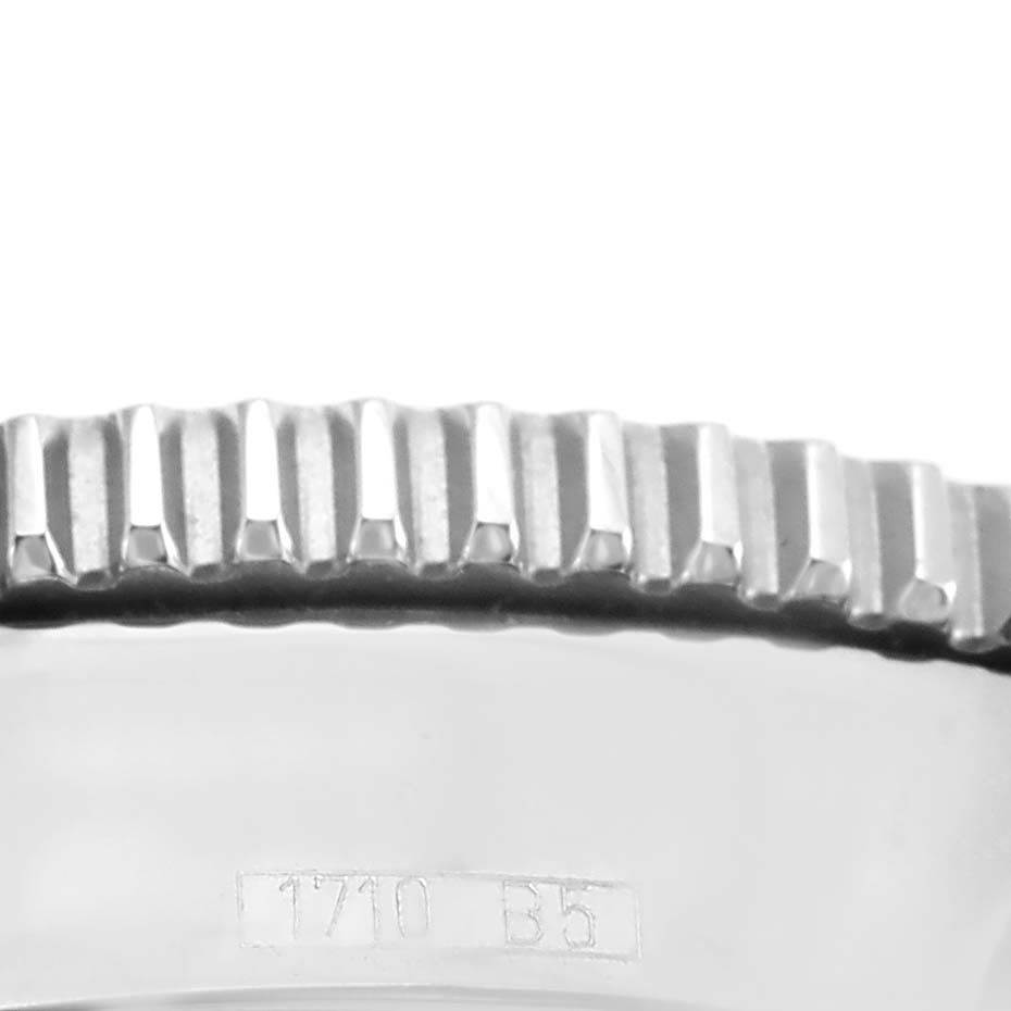 This image shows a close-up of the bezel and part of the case, with markings visible, of a Breitling Superocean A17364 Men's Stainless Steel Black Dial A17364 Men's Stainless Steel Black Dial watch.