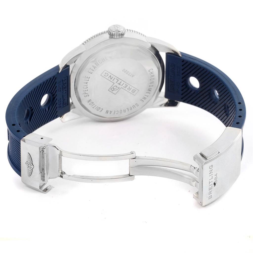 The image shows the back case and open clasp of a Breitling Superocean A17320 Men's Stainless Steel Blue Dial A17320 Men's Stainless Steel Blue Dial watch, along with its blue rubber strap.