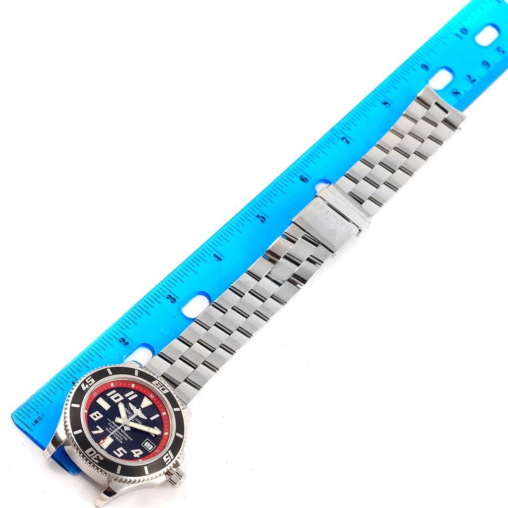 The Breitling Superocean A17364 Men's Stainless Steel Black Dial A17364 Men's Stainless Steel Black Dial watch is shown horizontally, displaying the face, bezel, and bracelet beside a ruler for scale.