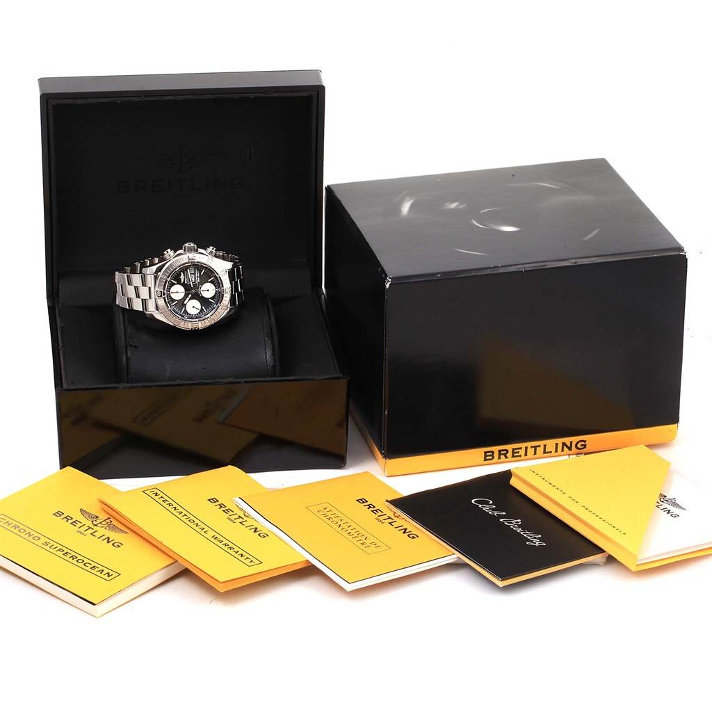 The Breitling Superocean A13340 Men's Stainless Steel Black Dial A13340 Men's Stainless Steel Black Dial watch is shown inside its box alongside its outer box and documentation at a slight angle.
