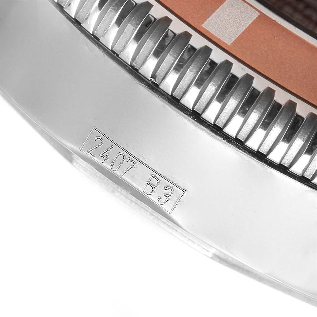 The image shows a close-up of the bezel and part of the case of the Breitling Superocean A17320 Men's Stainless Steel Brown Dial A17320 Men's Stainless Steel Brown Dial watch, with engraved numbers visible.