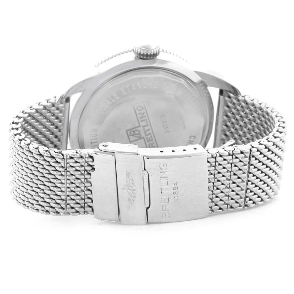 The image shows the back of a Breitling Superocean A17320 Men's Stainless Steel Brown Dial A17320 Men's Stainless Steel Brown Dial watch and its metal mesh strap with the clasp.