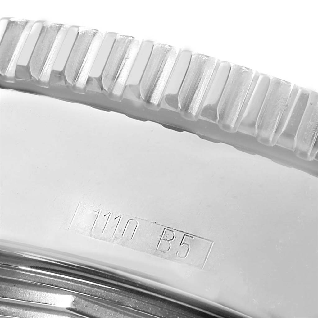 The image shows a close-up of the bezel and part of the case back of a Breitling Superocean A17364 Men's Stainless Steel Black Dial A17364 Men's Stainless Steel Black Dial watch.