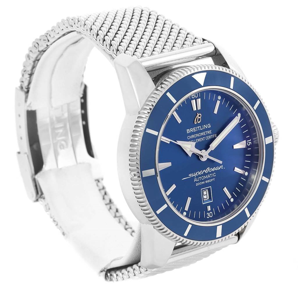 The image shows a Breitling Superocean A17320 Men's Stainless Steel Blue Dial A17320 Men's Stainless Steel Blue Dial watch at an angled view, highlighting its blue dial, bezel, and stainless steel mesh strap.