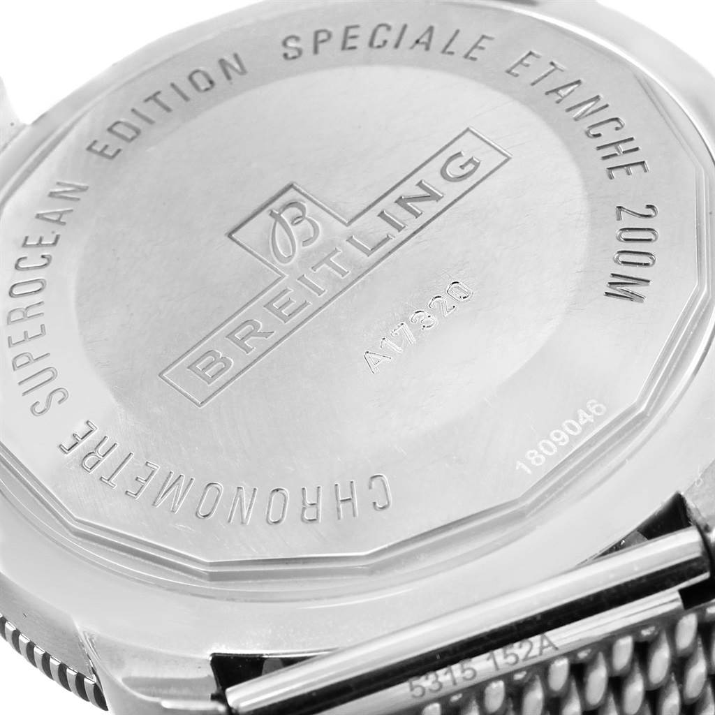 The image shows the back case of a Breitling Superocean A17320 Men's Stainless Steel Blue Dial A17320 Men's Stainless Steel Blue Dial watch, displaying its engraving and some parts of the strap.
