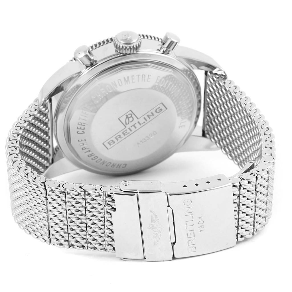 The image shows the back of a Breitling Superocean A13320 Men's Stainless Steel Black Dial A13320 Men's Stainless Steel Black Dial watch, featuring its caseback, crown, and metal mesh bracelet with a clasp.