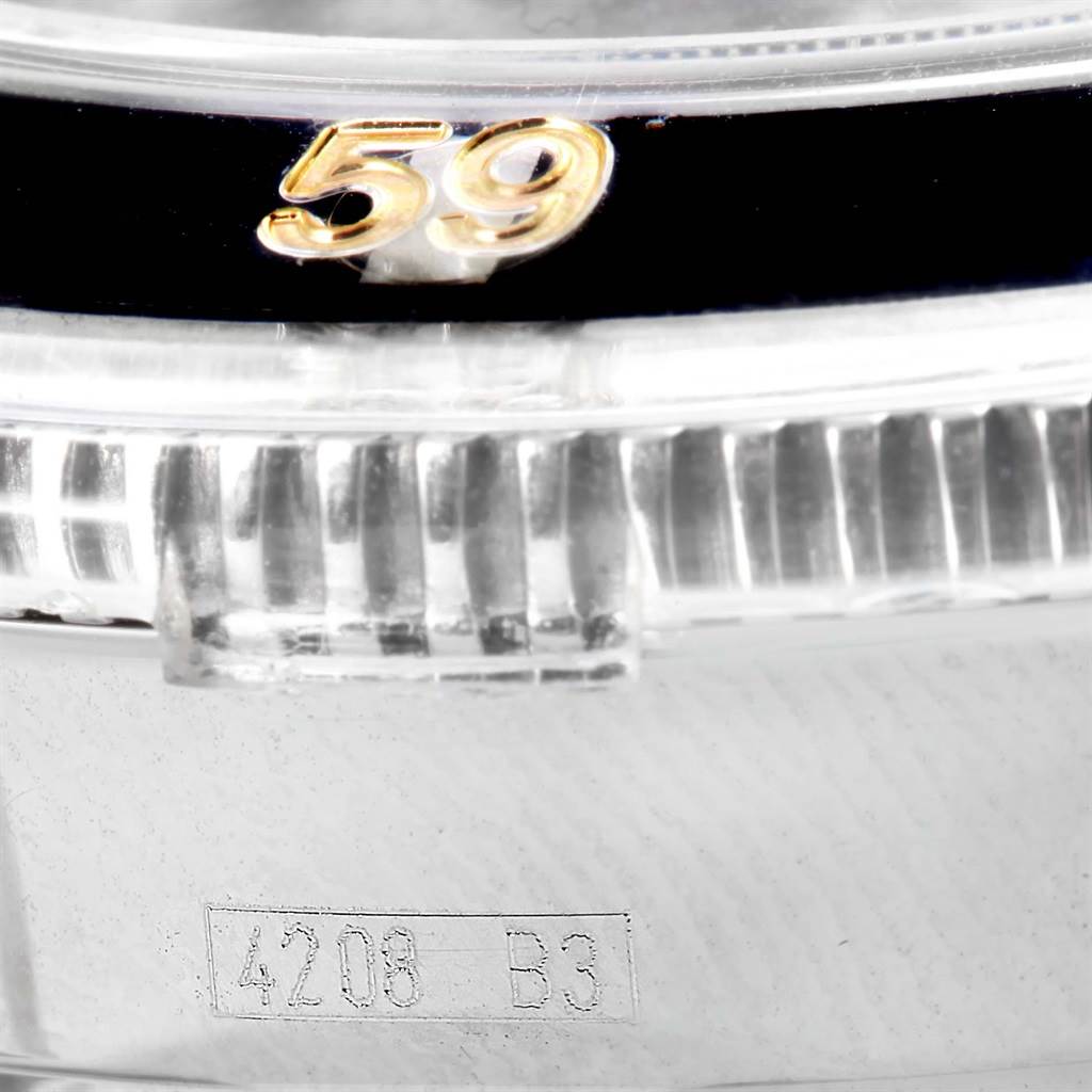 This close-up image of the Breitling Superocean A13320 Men's Stainless Steel Black Dial A13320 Men's Stainless Steel Black Dial watch shows the bezel, the number "59," and part of the case with the engraving "4208 B3".