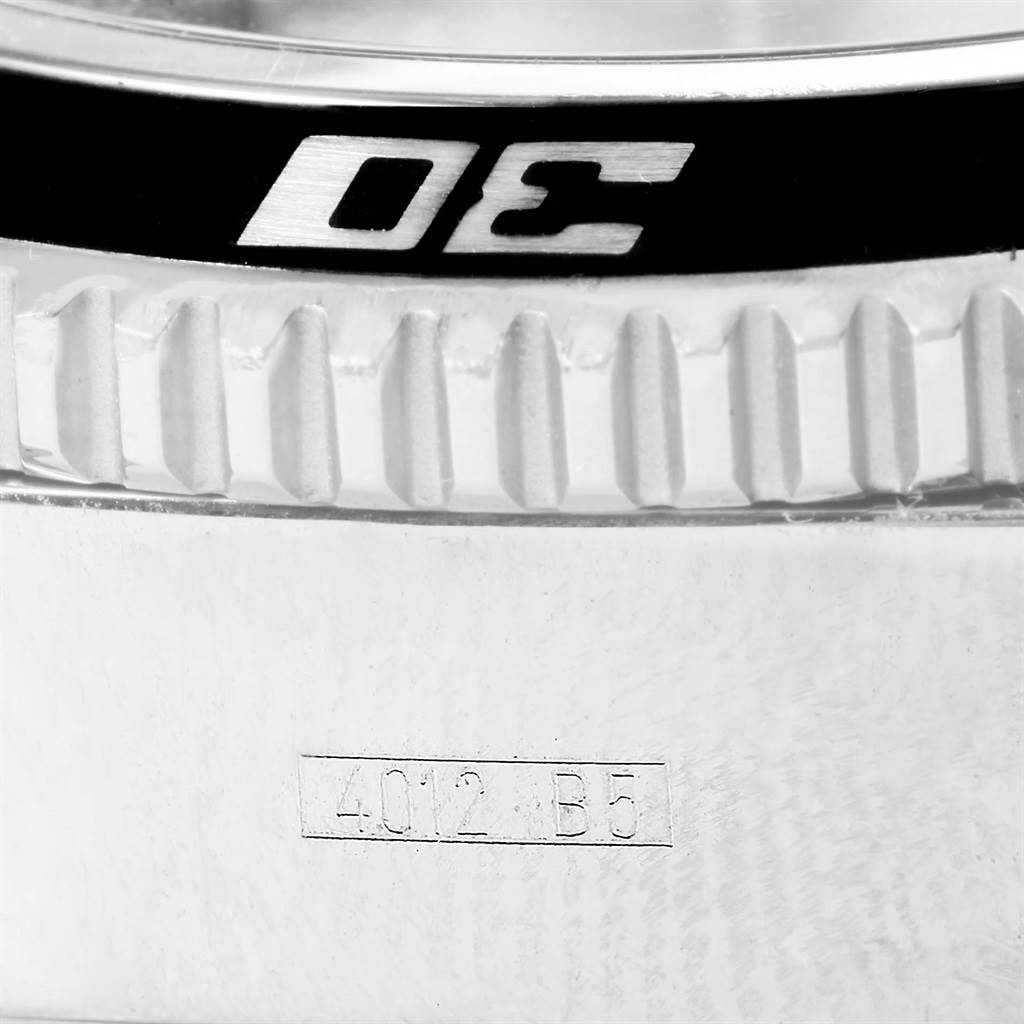 This close-up image of the Breitling Superocean A13341 Men's Stainless Steel Black Dial A13341 Men's Stainless Steel Black Dial watch shows the bezel and part of the case with engravings.