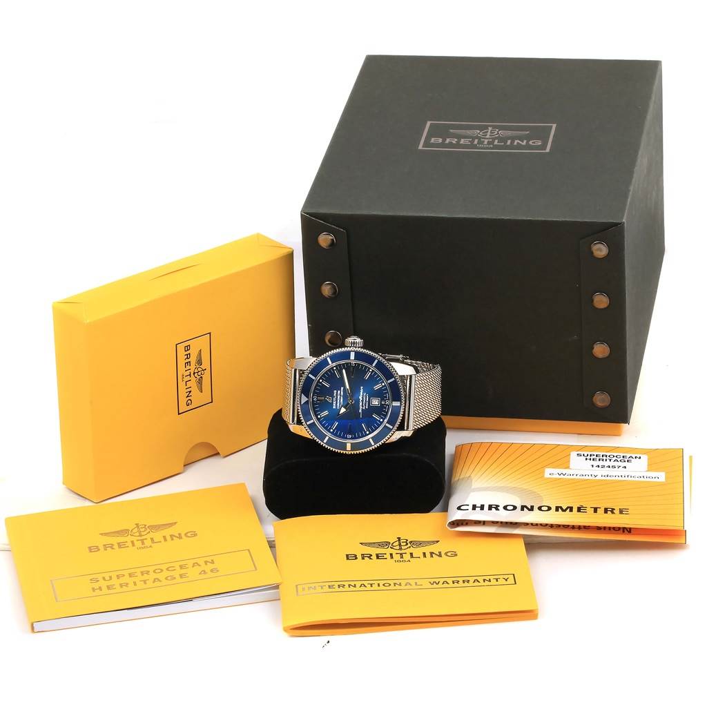 The image shows a Breitling Superocean A17320 Men's Stainless Steel Blue Dial A17320 Men's Stainless Steel Blue Dial watch with accessories, including manuals and the watch box, displayed from a front angle.