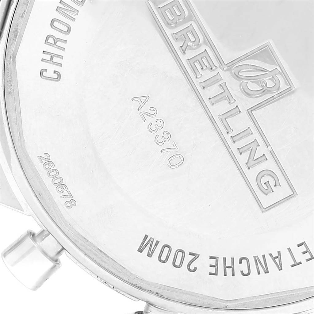 The image shows the back casing and part of the crown of a Breitling Superocean A23370 Men's Stainless Steel Black Dial A23370 Men's Stainless Steel Black Dial watch, featuring engravings and the brand logo.
