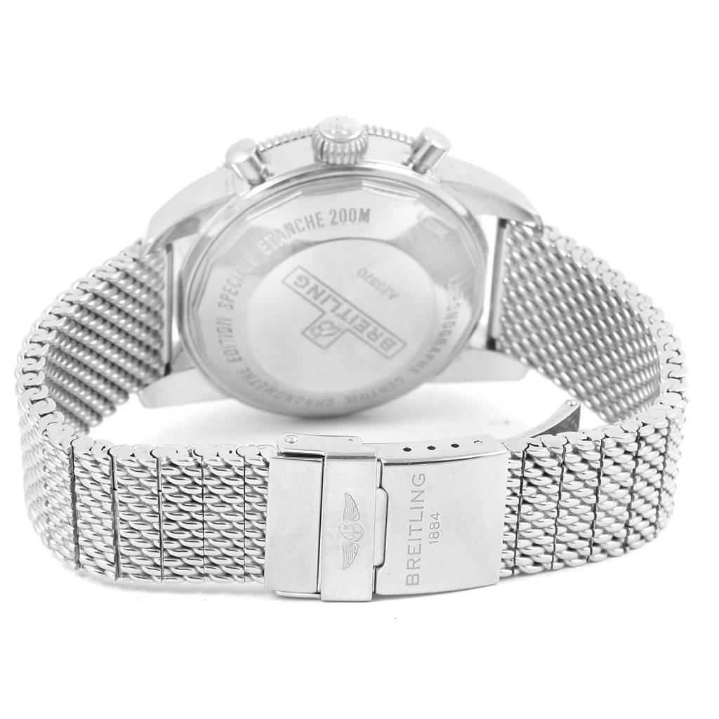 This Breitling Superocean A23370 Men's Stainless Steel Black Dial A23370 Men's Stainless Steel Black Dial watch is shown from the back, highlighting the case back and the metal mesh strap with clasp.