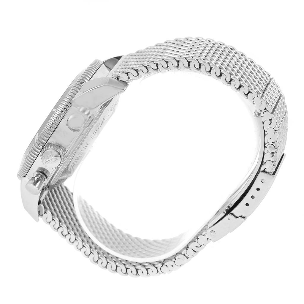 This side view of the Breitling Superocean A23370 Men's Stainless Steel Blue Dial A23370 Men's Stainless Steel Blue Dial watch showcases its mesh strap, clasp, and case with the crown.