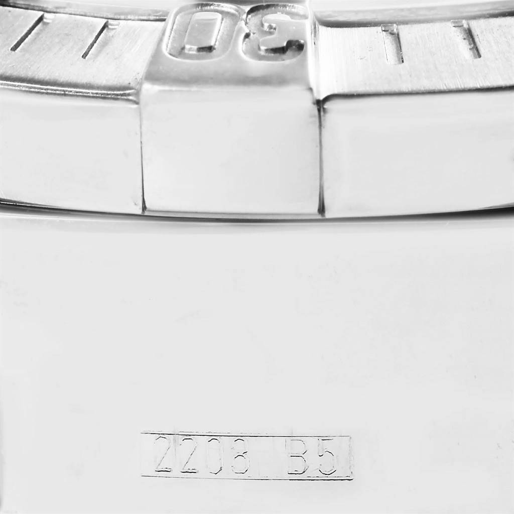 This image shows a close-up of the bezel and part of the case back of a Breitling Superocean A13340 Men's Stainless Steel Black Dial A13340 Men's Stainless Steel Black Dial watch.