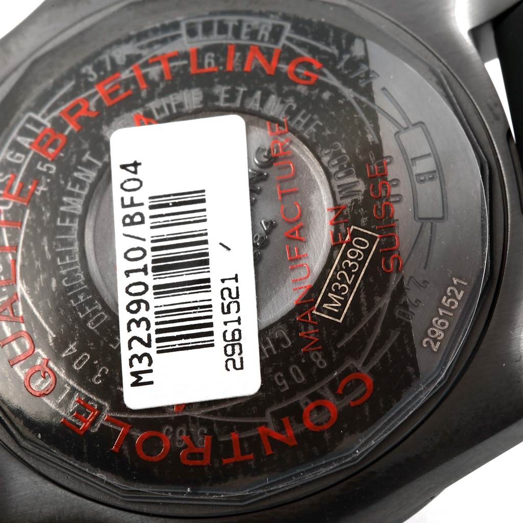The image shows the back of the Breitling Avenger M32390 Men's Stainless Steel Black Dial M32390 Men's Stainless Steel Black Dial watch, including serial numbers and branding, with a barcode sticker attached.