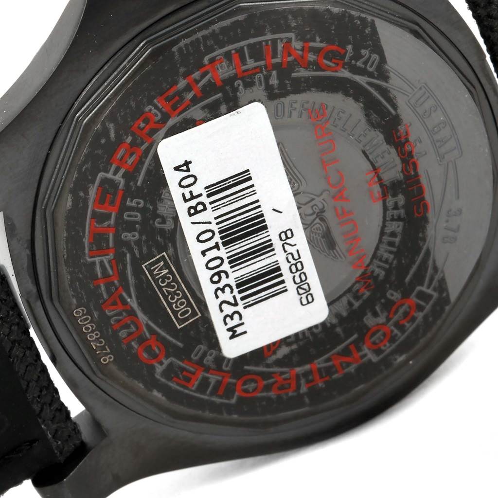 The image shows the back case of a Breitling Avenger M32390 Men's Stainless Steel Black Dial M32390 Men's Stainless Steel Black Dial watch with markings and a barcode sticker.