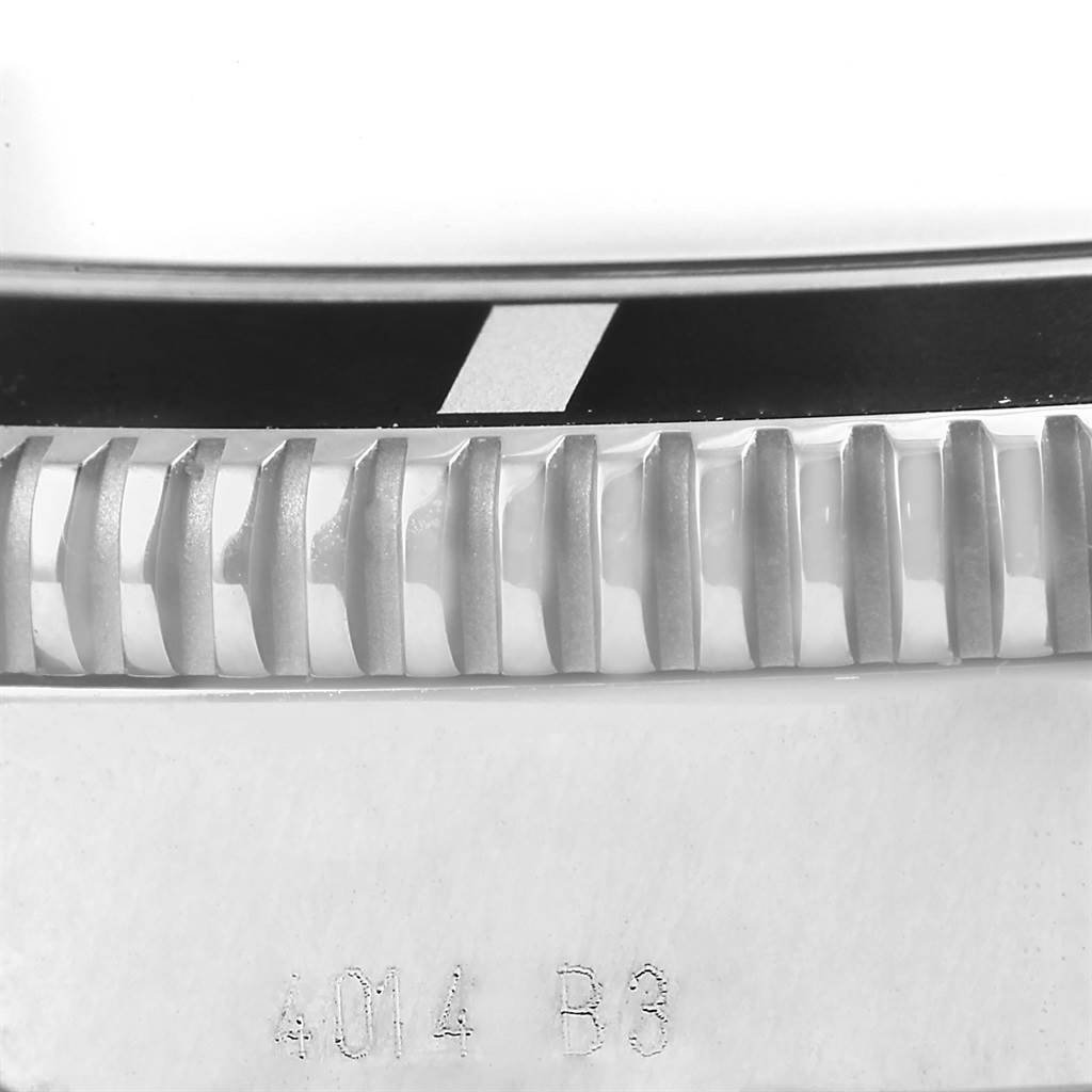 This image shows a close-up of the bezel and part of the casing of a Breitling Superocean A17320 Men's Stainless Steel Black Dial A17320 Men's Stainless Steel Black Dial watch, viewed from a macro angle.