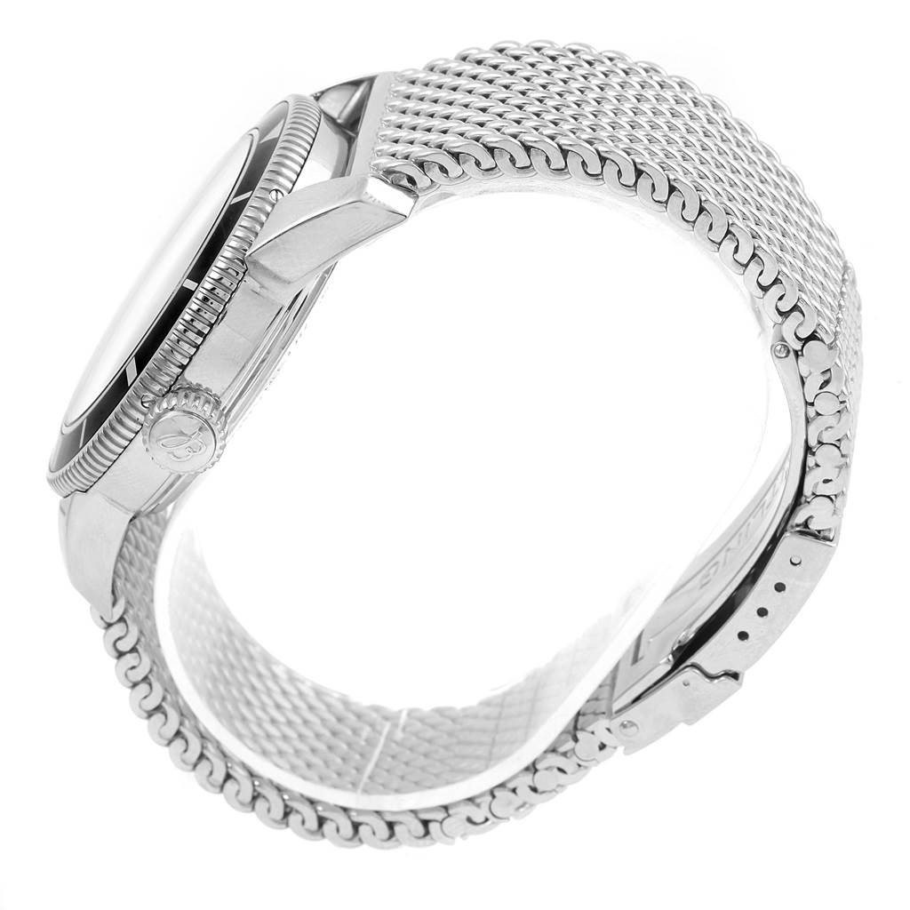 This image shows a side view of the Breitling Superocean A17321 Men's Stainless Steel Black Dial A17321 Men's Stainless Steel Black Dial watch highlighting the crown, case, bezel, and the metallic mesh bracelet.