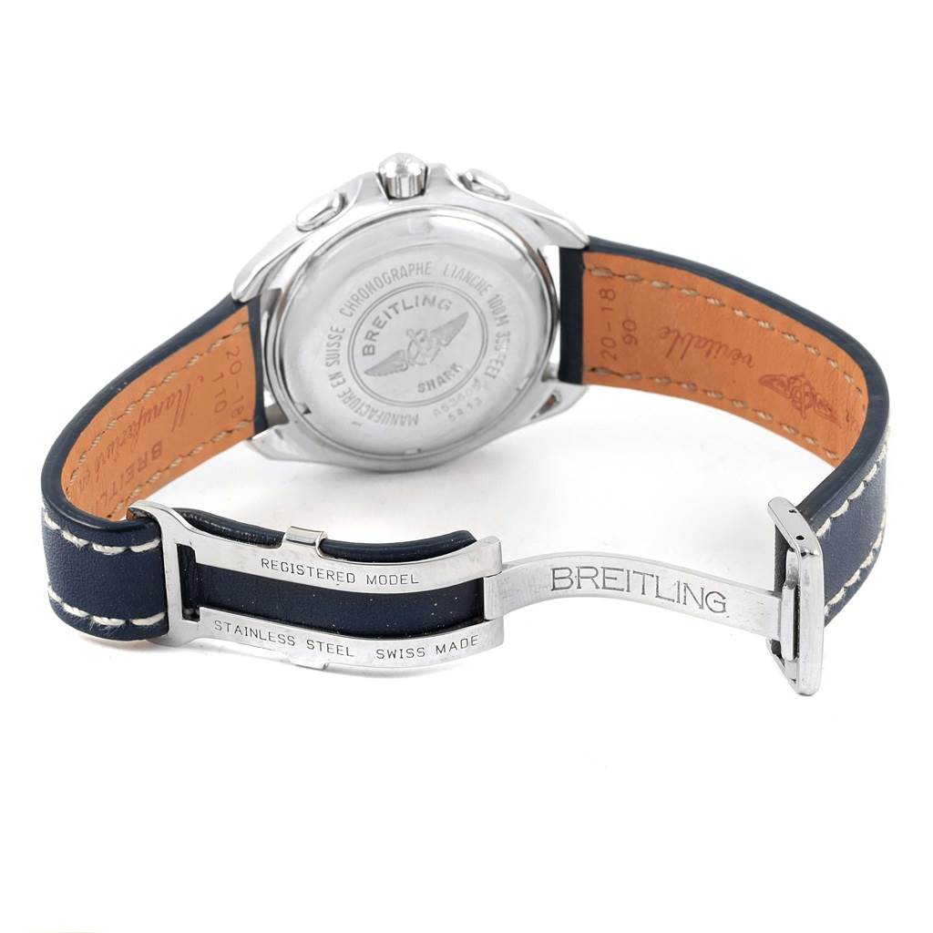 The image shows the back case and clasp of a Breitling Superocean A53605 Men's Stainless Steel Silver Dial A53605 Men's Stainless Steel Silver Dial watch, highlighting the leather strap and engraved clasp.