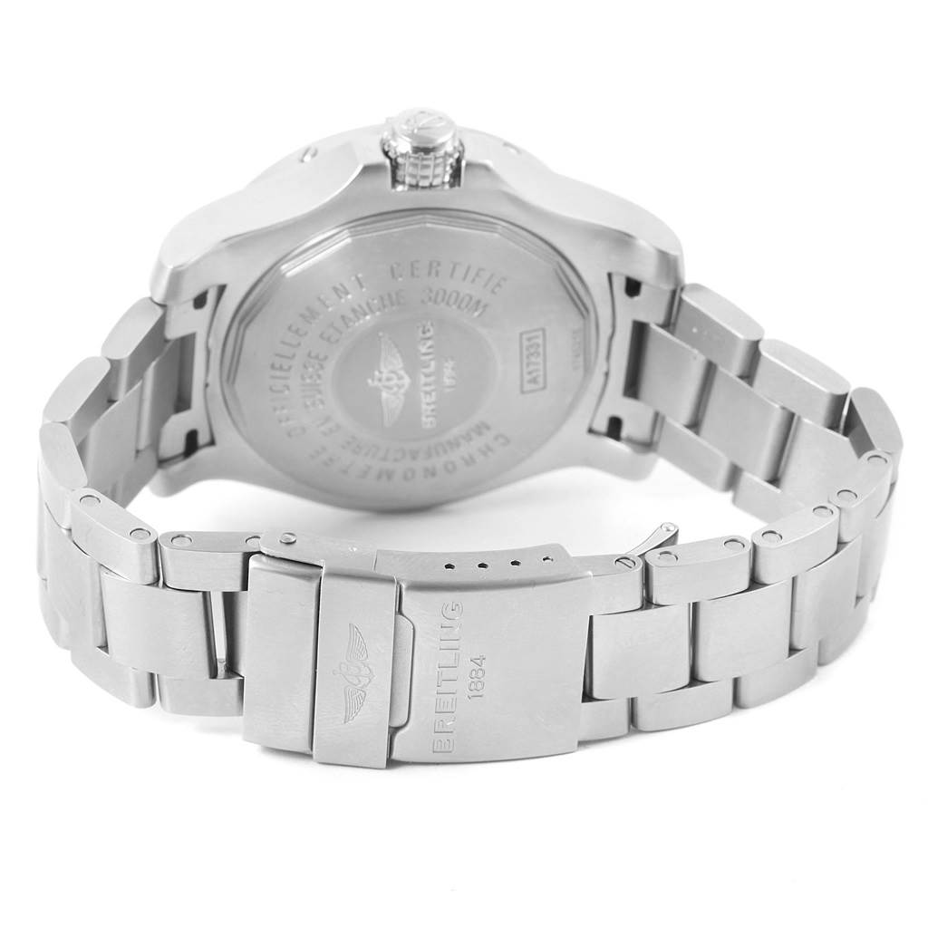 The image shows the back view and clasp of a Breitling Avenger A17331 Men's Stainless Steel Black Dial A17331 Men's Stainless Steel Black Dial watch, focusing on the stainless steel bracelet and engraved case back.