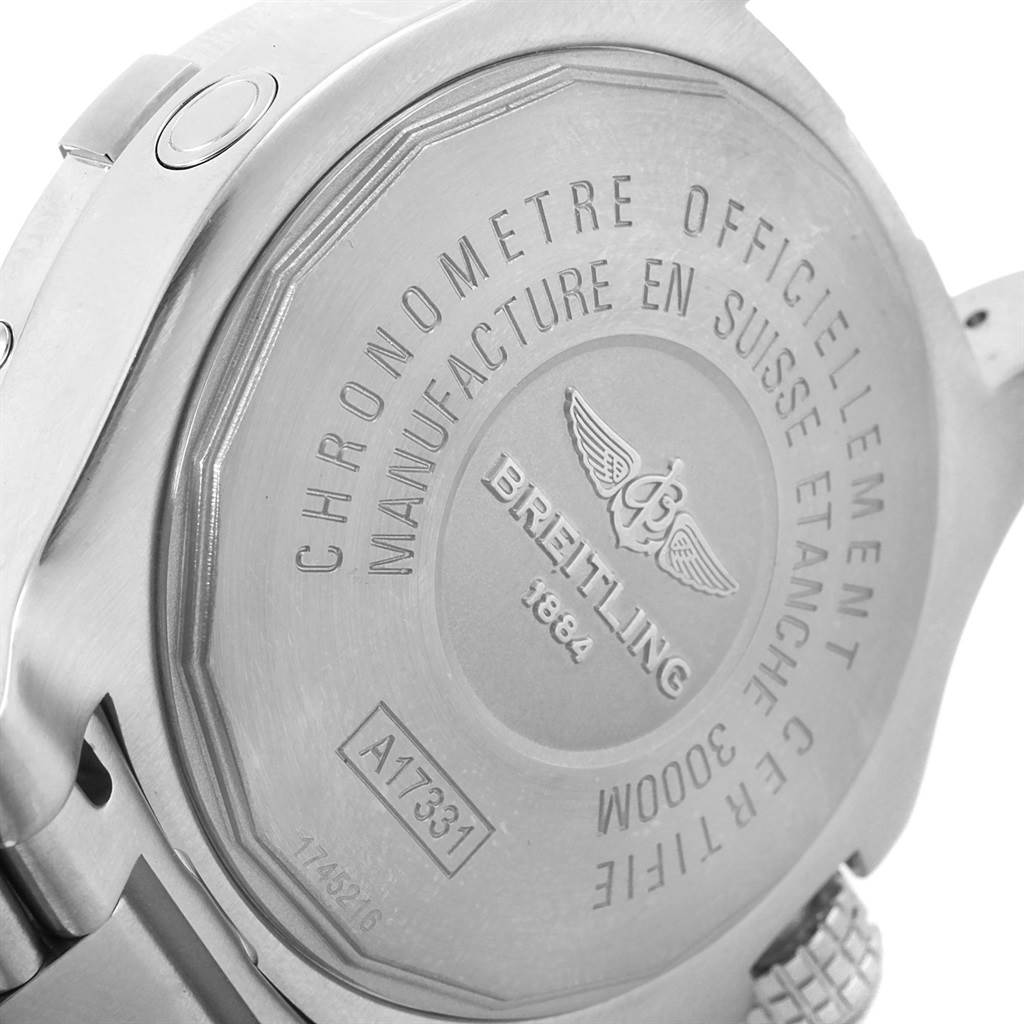 This image shows the back case and part of the crown stem of a Breitling Avenger A17331 Men's Stainless Steel Black Dial A17331 Men's Stainless Steel Black Dial watch, highlighting its engravings and serial number.
