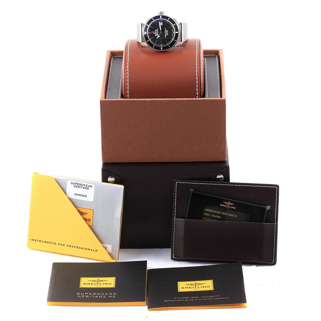 The Breitling Superocean A17321 Men's Stainless Steel Black Dial A17321 Men's Stainless Steel Black Dial watch is shown at a straight-on angle with its box and accompanying booklets and documents.