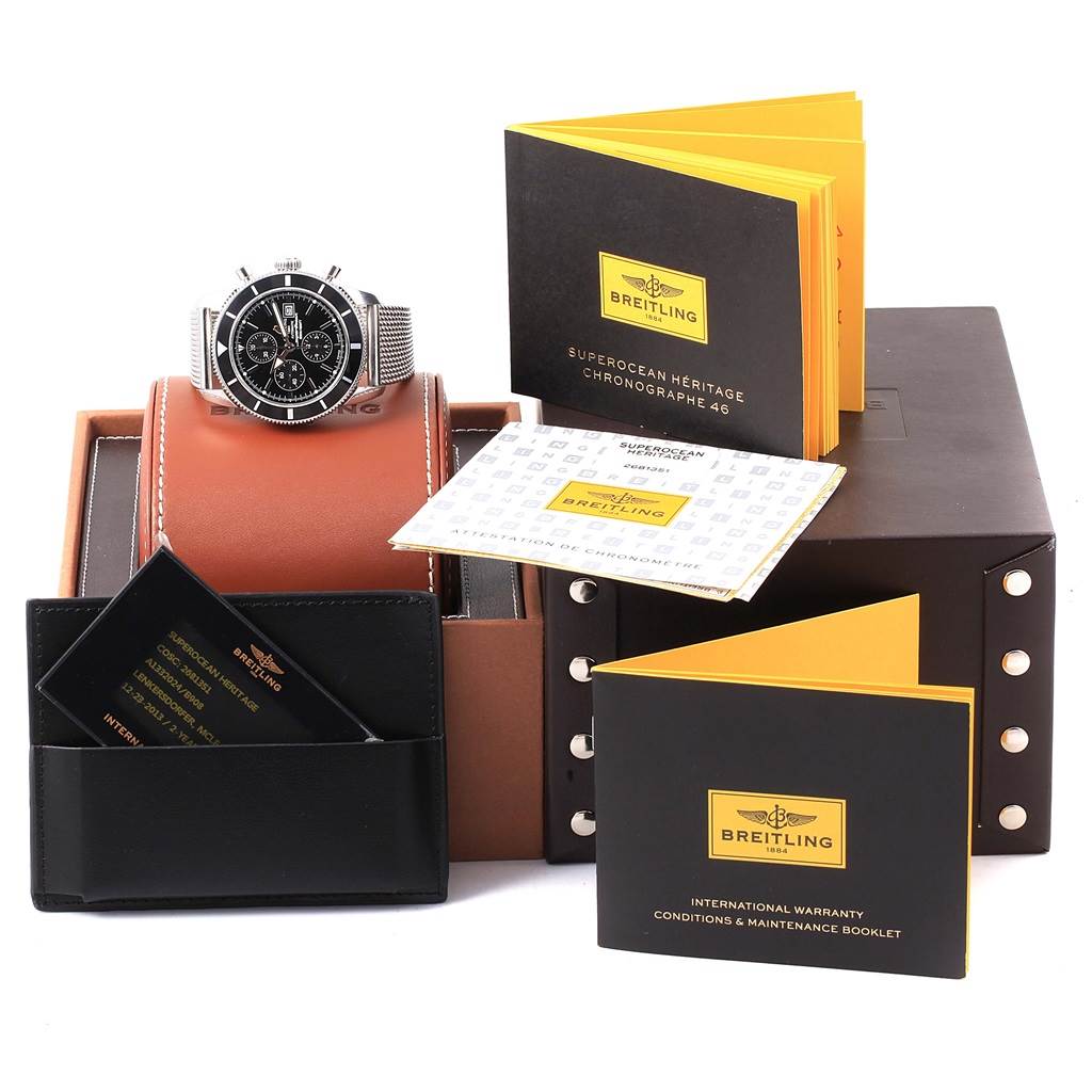 The image shows the Breitling Superocean A13320 Men's Stainless Steel Black Dial A13320 Men's Stainless Steel Black Dial watch at an angled frontal view, along with its box, booklets, and warranty card.
