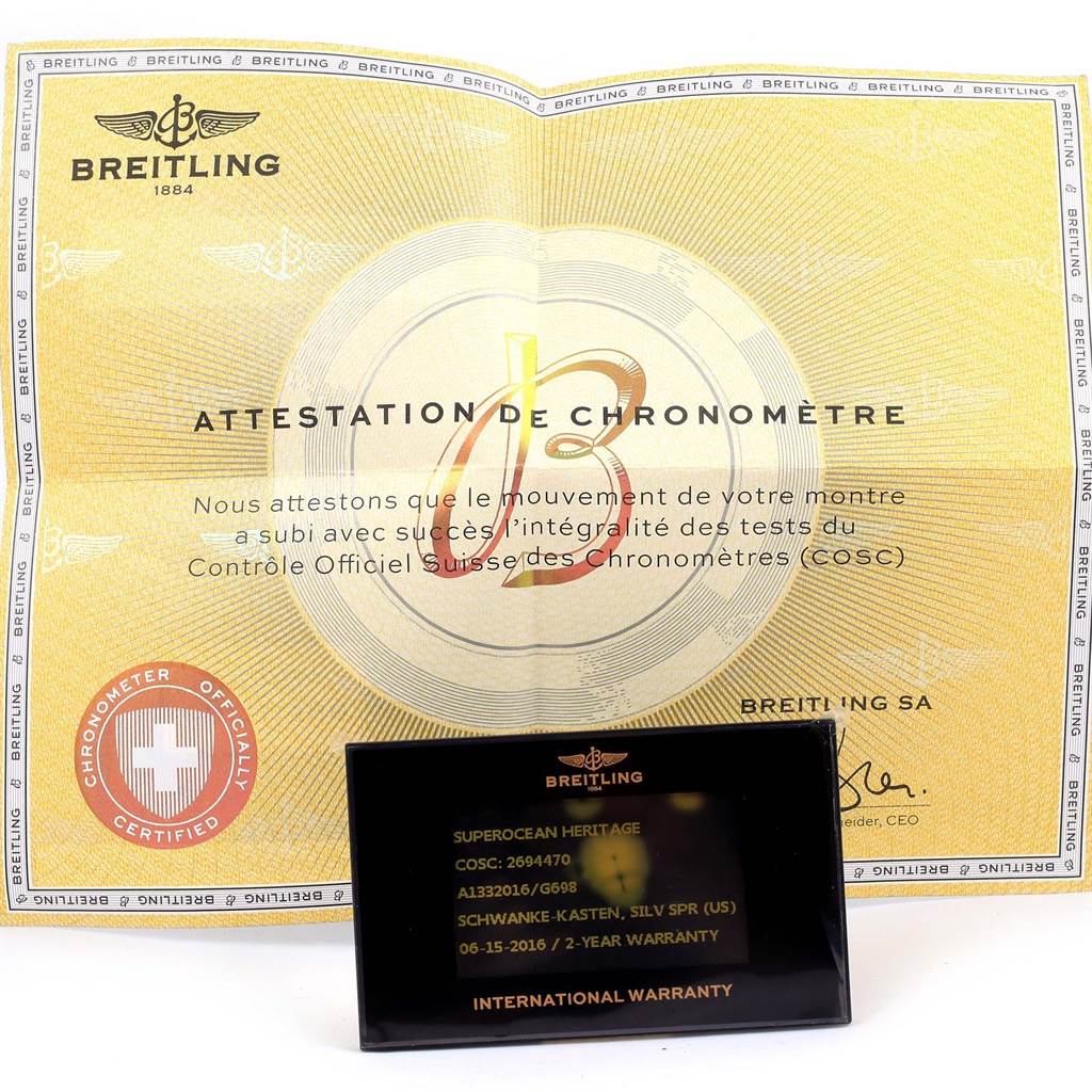 This image shows a Breitling Superocean A13320 Men's Stainless Steel Silver Dial A13320 Men's Stainless Steel Silver Dial Heritage chronometer certificate and international warranty card.