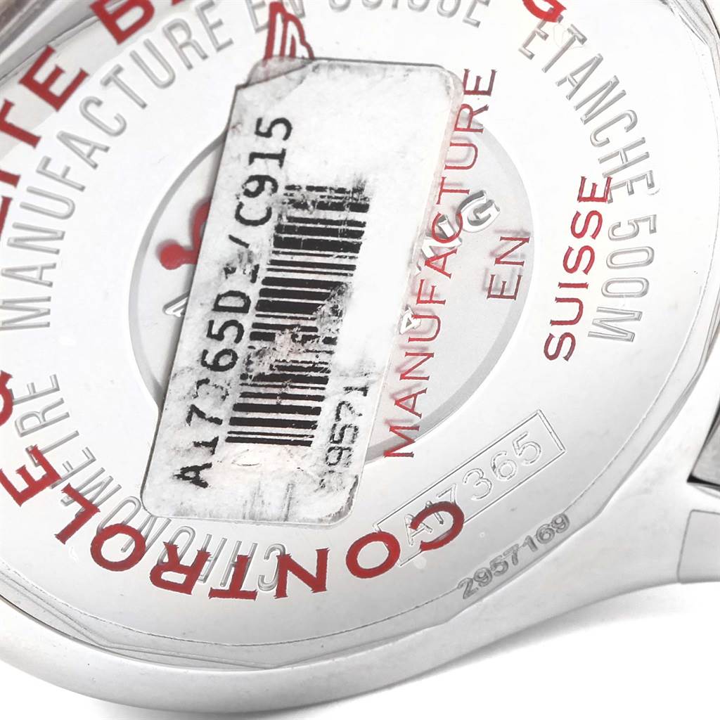 This image shows the back casing and parts of the strap of a Breitling Superocean A17365 Men's Stainless Steel Blue Dial A17365 Men's Stainless Steel Blue Dial watch, including some text and a barcode sticker.