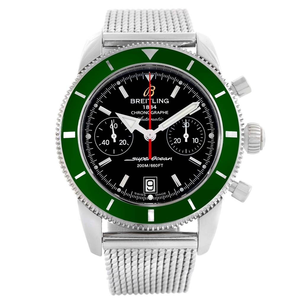 The image shows a front view of the Breitling Superocean A23370 Men's Stainless Steel Black Dial A23370 Men's Stainless Steel Black Dial watch, featuring its green bezel, black dial, and mesh bracelet.
