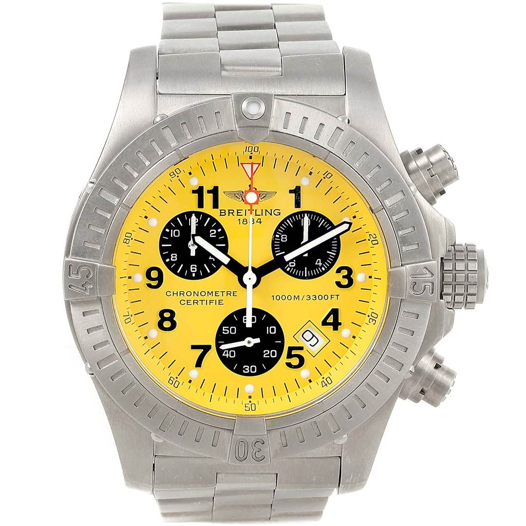 The image shows a frontal view of a Breitling Avenger E73360 Men's Titanium Yellow Dial E73360 Men's Titanium Yellow Dial watch, highlighting its yellow dial, chronometer subdials, and metal bracelet.