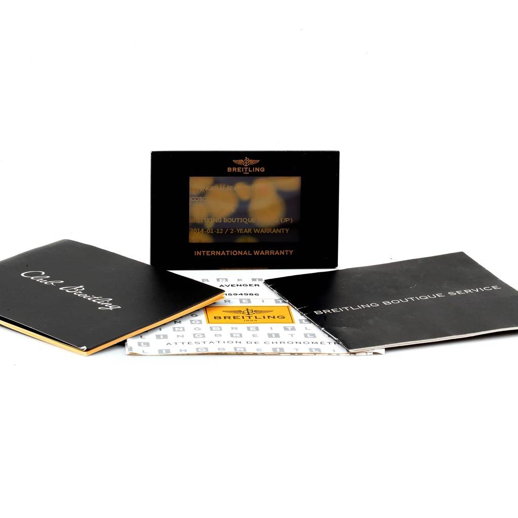 This image shows the warranty card, manual, and documentation for the Breitling Avenger A17331 Men's Stainless Steel Yellow Dial A17331 Men's Stainless Steel Yellow Dial watch model.
