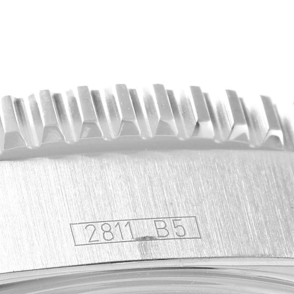 This close-up image shows the edge of the bezel and part of the caseback with an engraved serial number on the Breitling Superocean A17391 Men's Stainless Steel Black Dial A17391 Men's Stainless Steel Black Dial watch.