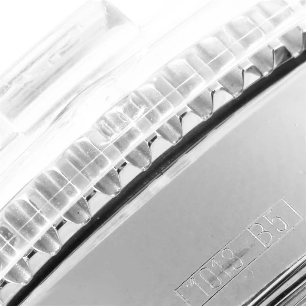 This close-up angle shows the bezel and part of the casing, including etched details, of the Breitling Superocean A17364 Men's Stainless Steel Black Dial A17364 Men's Stainless Steel Black Dial watch.