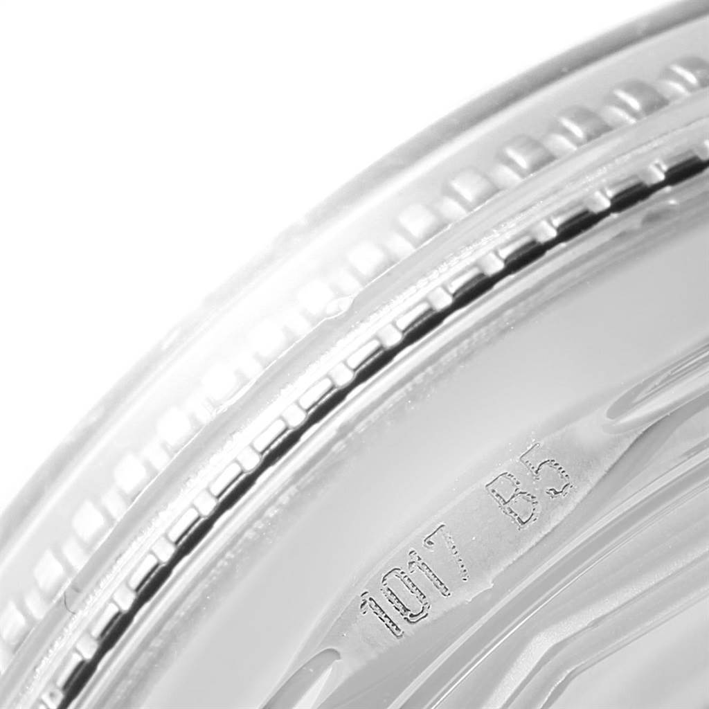 This close-up angle of the Breitling Superocean A17321 Men's Stainless Steel Black Dial A17321 Men's Stainless Steel Black Dial watch shows the edge of the bezel and part of the case with some serial numbers.