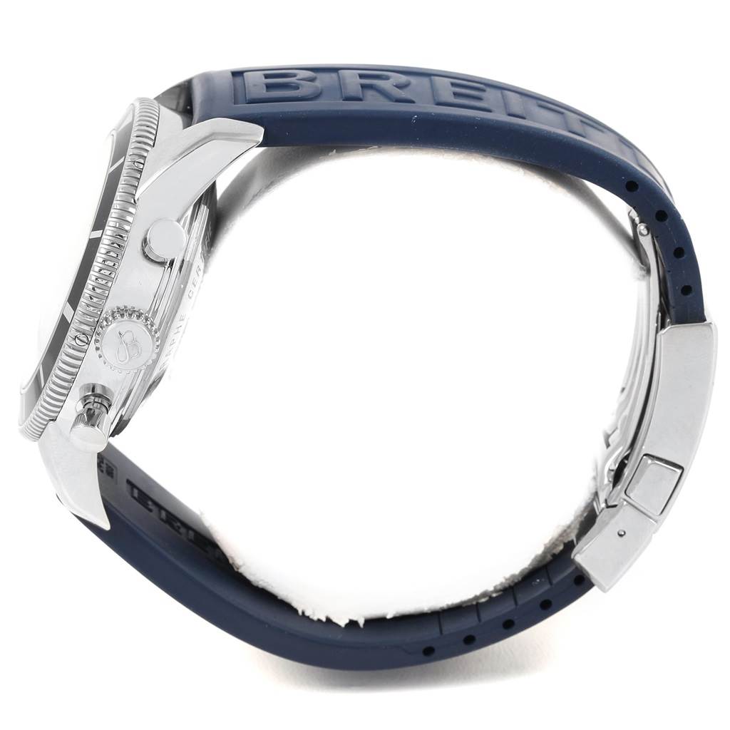 The image shows a side view of the Breitling Superocean A13320 Men's Stainless Steel Silver Dial A13320 Men's Stainless Steel Silver Dial watch, highlighting the case, crown, pushers, and blue rubber strap.