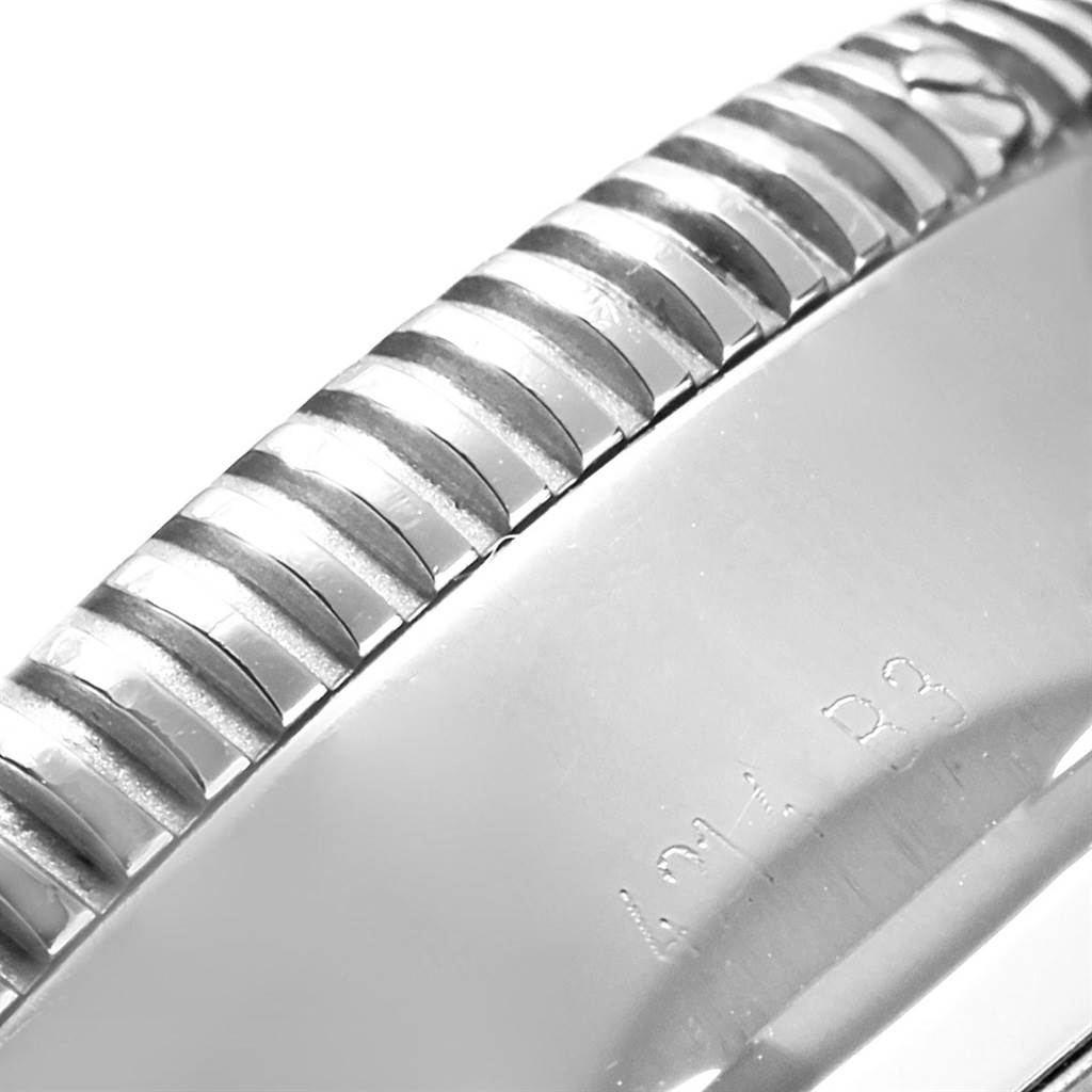 This image shows a close-up of the bezel and part of the case of a Breitling Superocean A13320 Men's Stainless Steel Silver Dial A13320 Men's Stainless Steel Silver Dial watch.