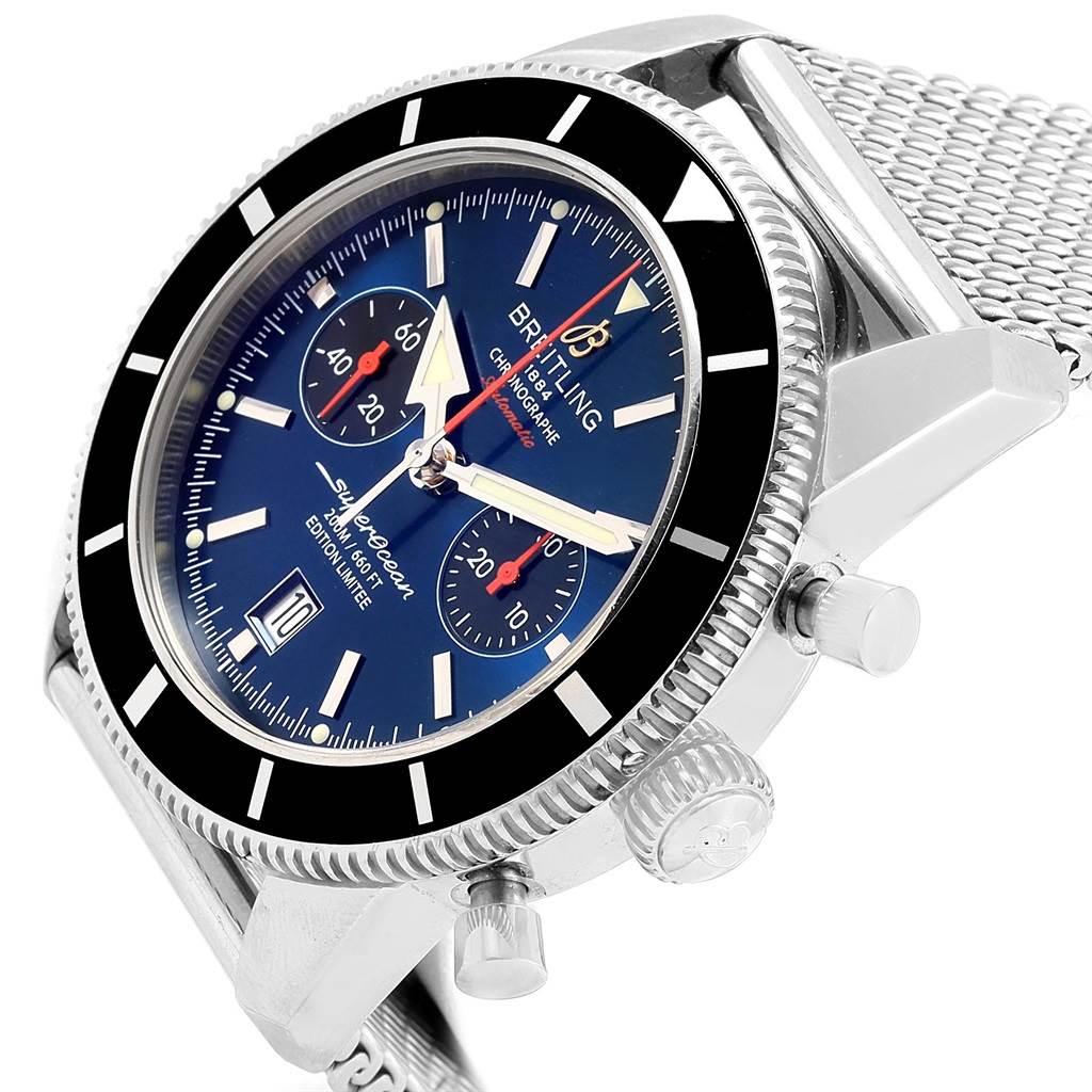 The image shows a side view of the Breitling Superocean A23320 Men's Stainless Steel Blue Dial A23320 Men's Stainless Steel Blue Dial watch, highlighting its dial, bezel, crown, pushers, and mesh strap.