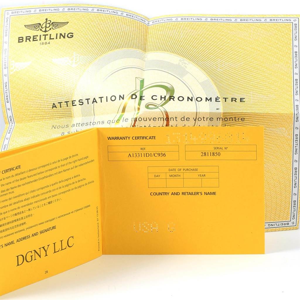 The image shows the warranty certificate and chronometer attestation from Breitling for the Superocean model.