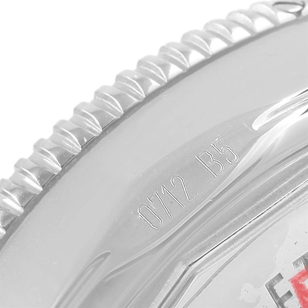 This image shows a close-up of the engraved bezel and part of the case back of a Breitling Superocean A17321 Men's Stainless Steel Blue Dial A17321 Men's Stainless Steel Blue Dial watch.