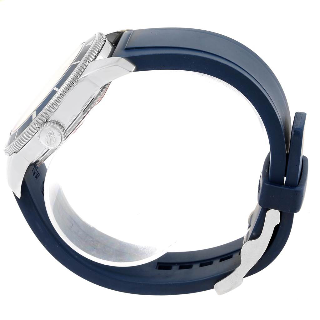 The image shows the side view of a Breitling Superocean A17321 Men's Stainless Steel Blue Dial A17321 Men's Stainless Steel Blue Dial watch, highlighting its case, bezel, crown, and blue strap with buckle.