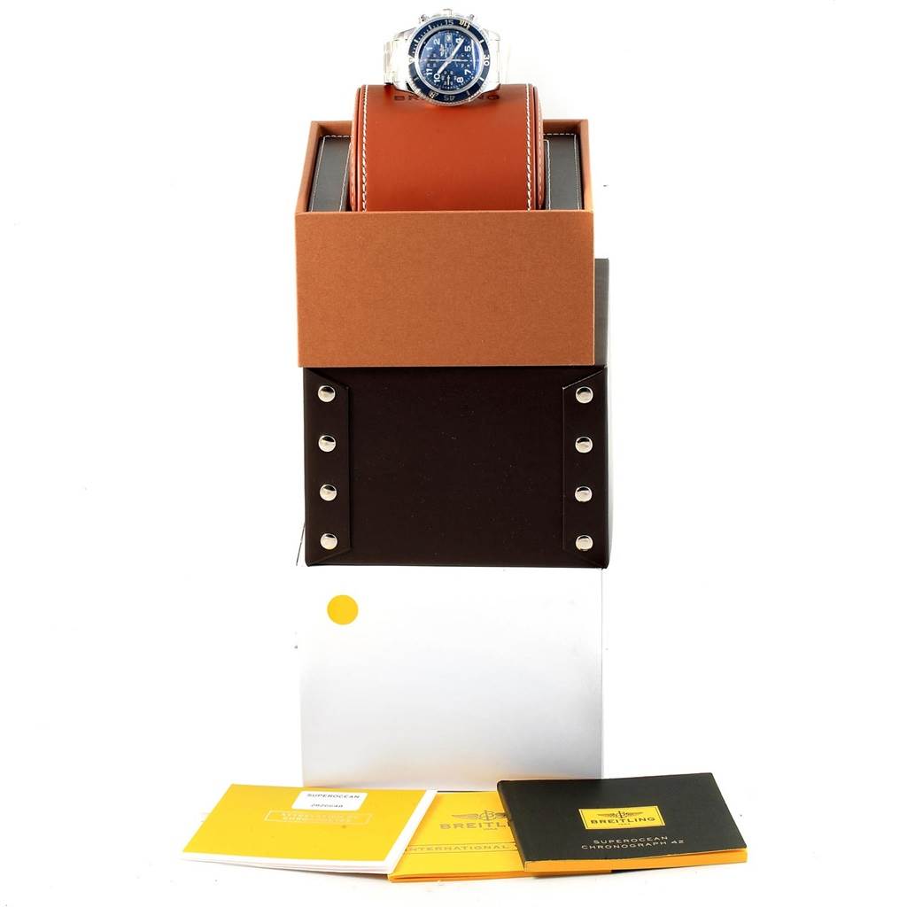 The image shows a Breitling Superocean A13311 Men's Stainless Steel Blue Dial A13311 Men's Stainless Steel Blue Dial watch from the front, along with its box accessories and manuals.