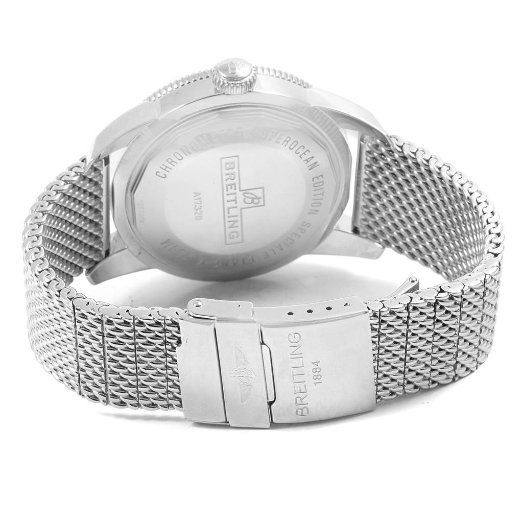 The image shows the back view of a Breitling Superocean A17320 Men's Stainless Steel Black Dial A17320 Men's Stainless Steel Black Dial watch, highlighting its case back and metal mesh strap with clasp.