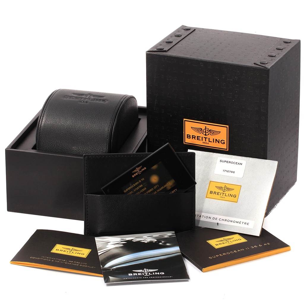 The image shows the complete packaging and accessories for the Breitling Superocean A17365 Men's Stainless Steel Blue Dial A17365 Men's Stainless Steel Blue Dial watch, including the box, manuals, and warranty cards.