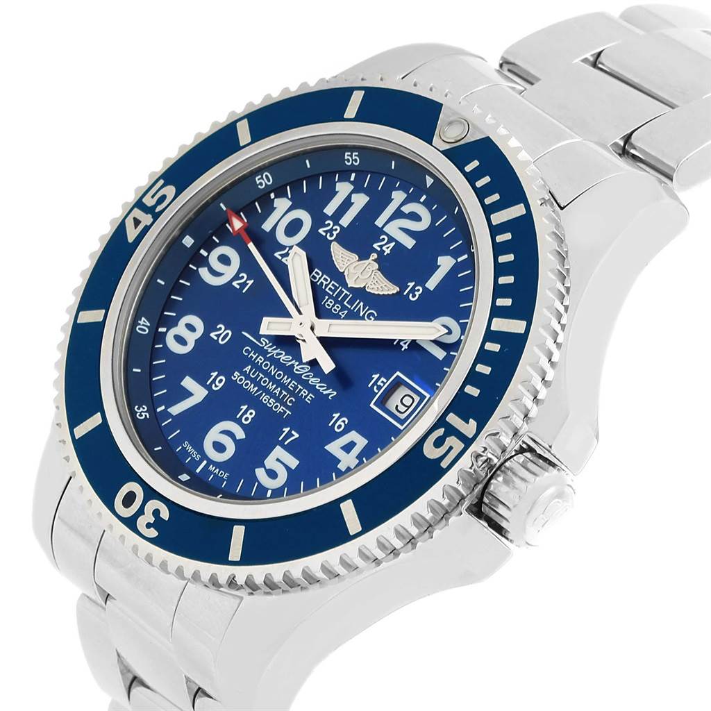The image shows a Breitling Superocean A17365 Men's Stainless Steel Blue Dial A17365 Men's Stainless Steel Blue Dial watch tilted to the right, highlighting its blue dial, bezel, crown, and metal bracelet.